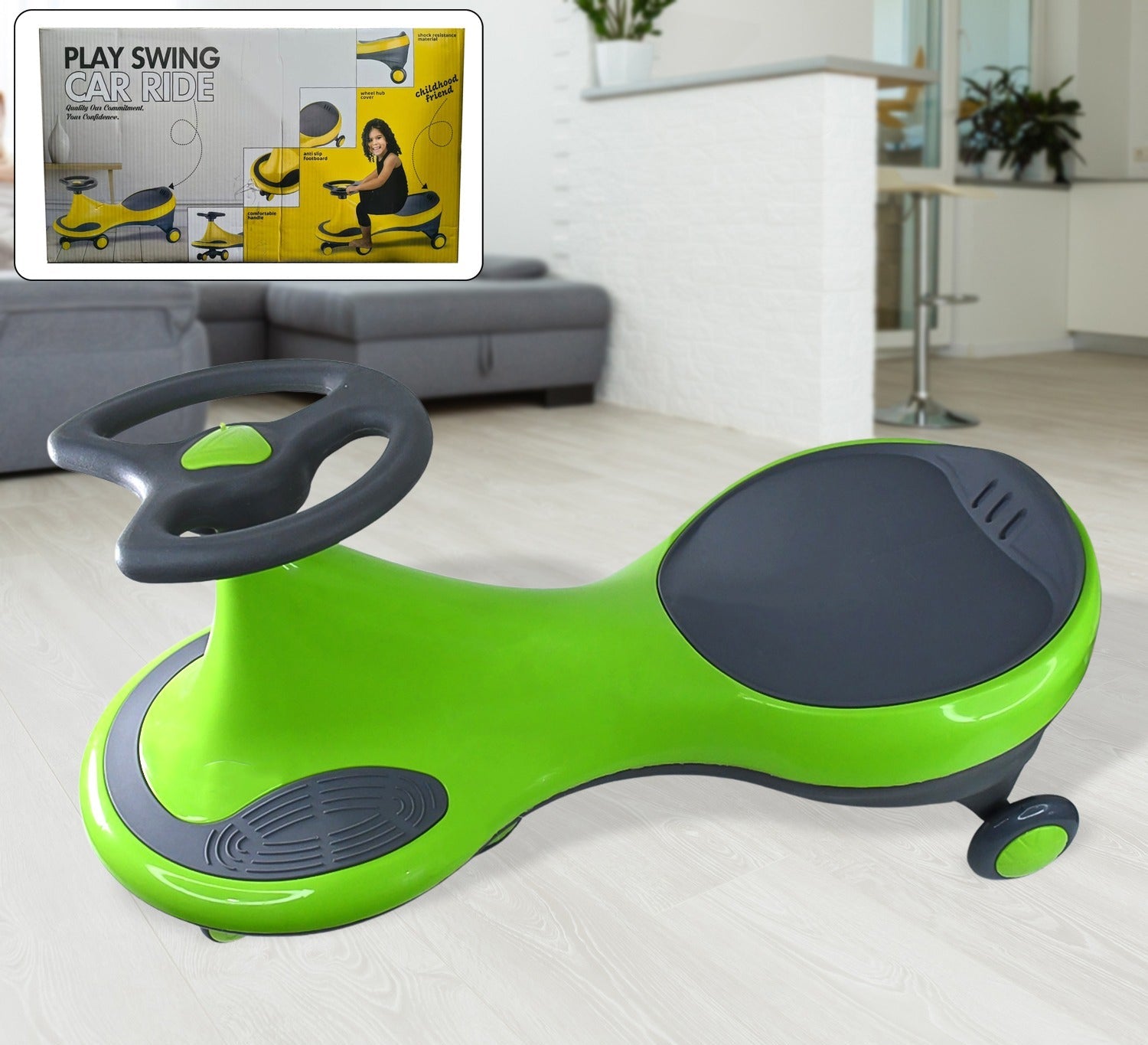 Green and gray toy car with steering wheel on a white floor, with packaging in the corner.